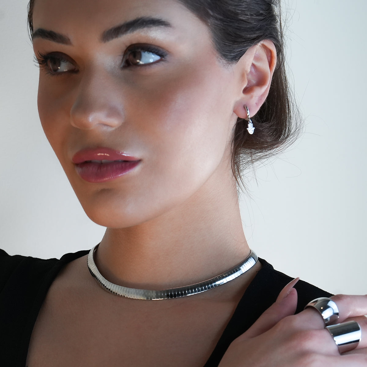 FATIMA White Gold (Silver Toned): Pavé Zirconia (CZ) Mini Hoop Earrings with Hamsa Hand Charm – A Perfect Blend of Style and Protection - Velora Luxury Fashion