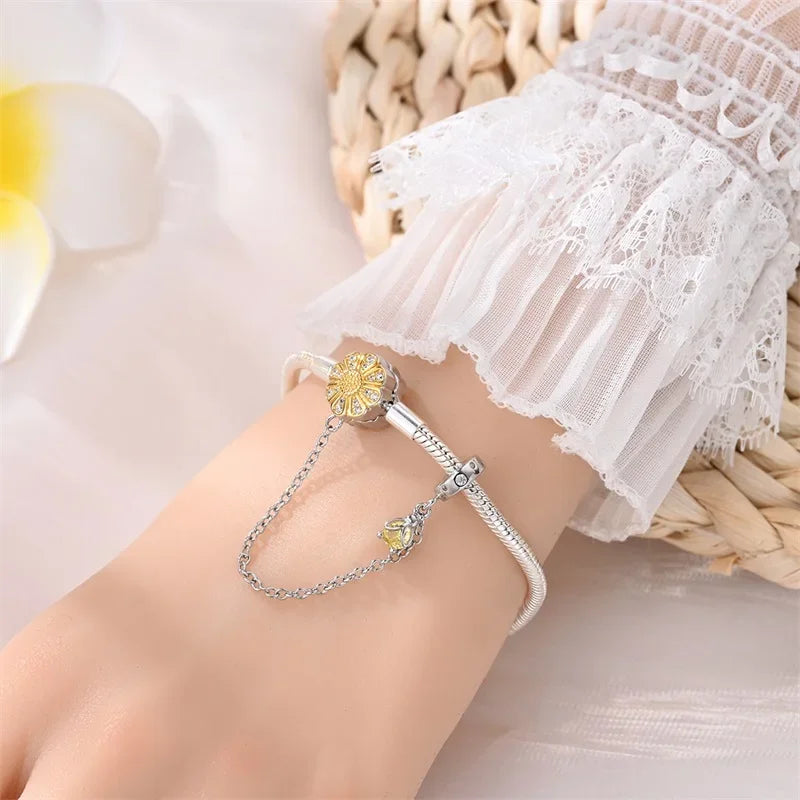 Radiant Daisy Sterling Silver Charm Bracelet With Dangling Chain - Velora