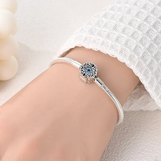 Sterling Silver Celtic Snowflake Charm Bracelet with Blue CZ - Velora Luxury Fashion