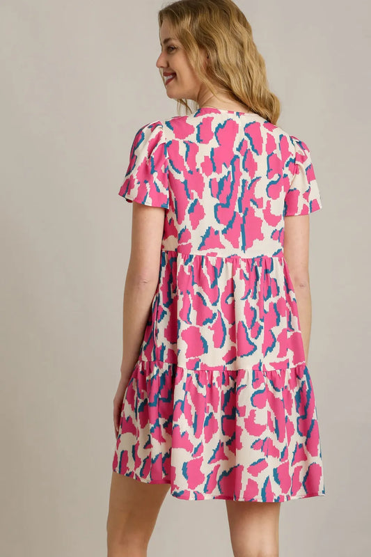 Umgee Full Size Abstract Print Pleat Detail Short Sleeve V-Neck Tiered Dress Plus Size - Velora