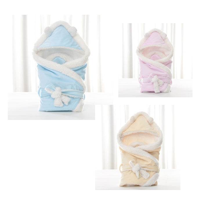 Newborn baby being hugged and swaddled by baby - Velora