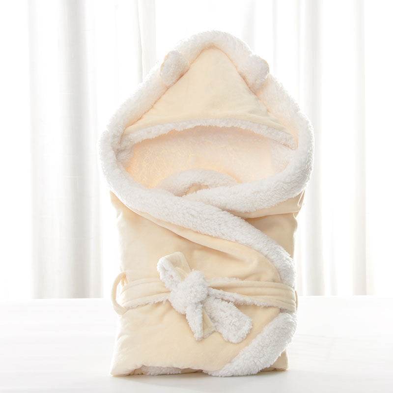 Newborn baby being hugged and swaddled by baby - Velora