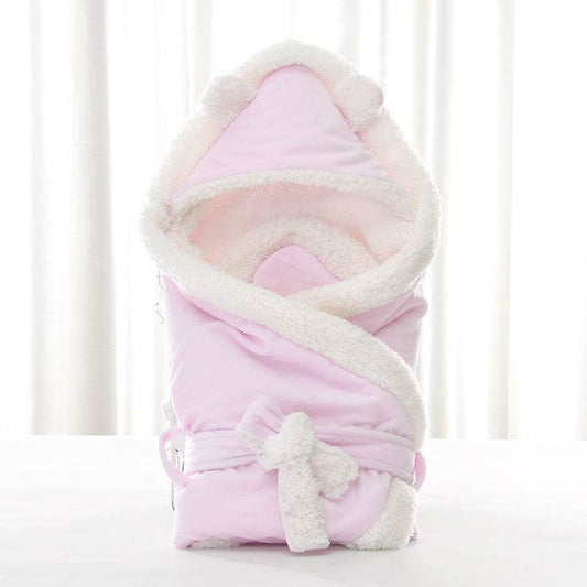 Newborn baby being hugged and swaddled by baby - Velora