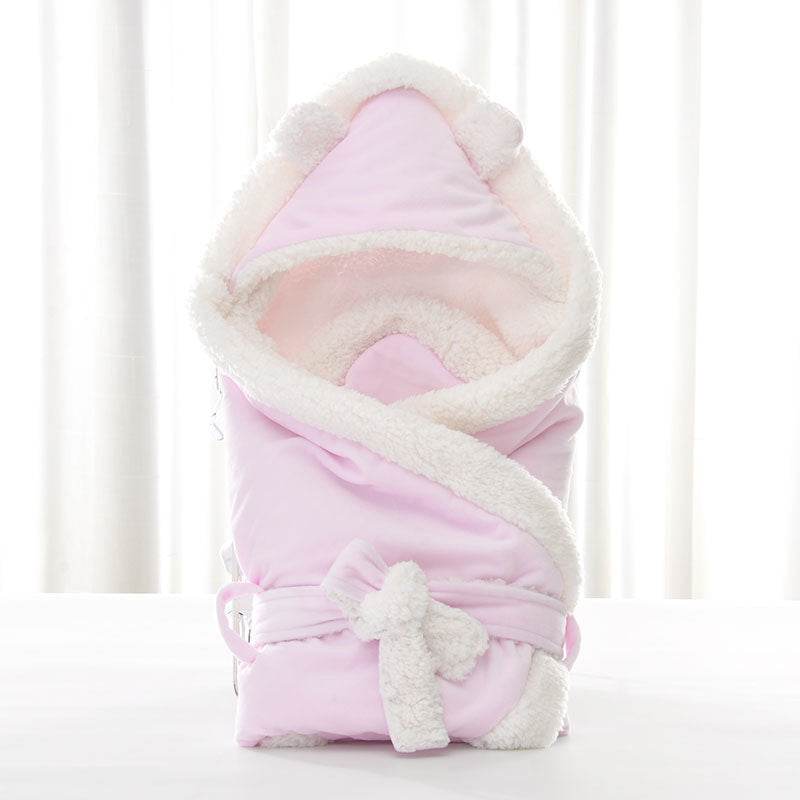 Newborn baby being hugged and swaddled by baby - Velora