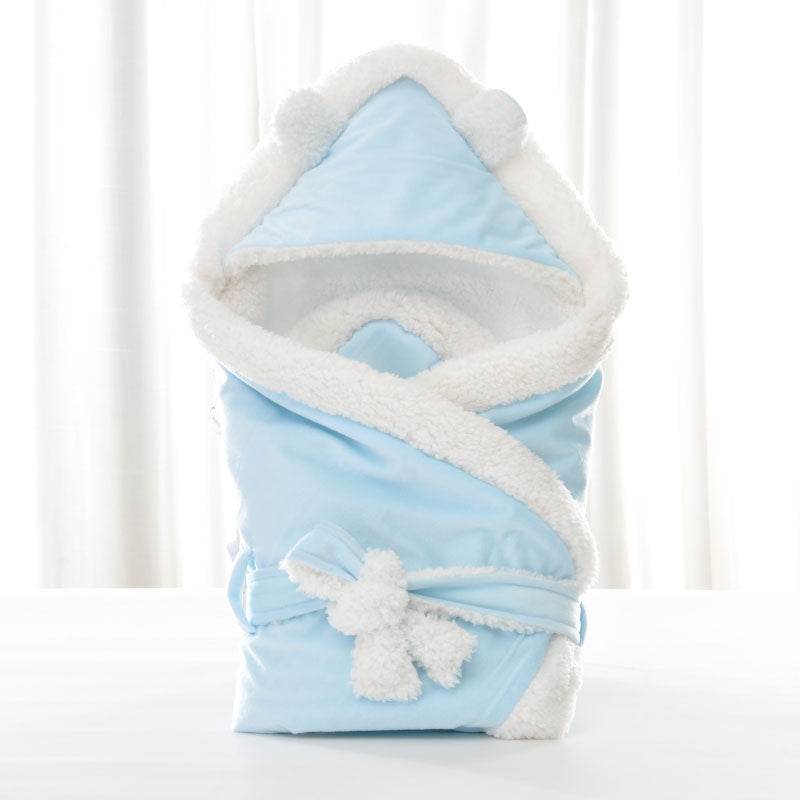 Newborn baby being hugged and swaddled by baby - Velora