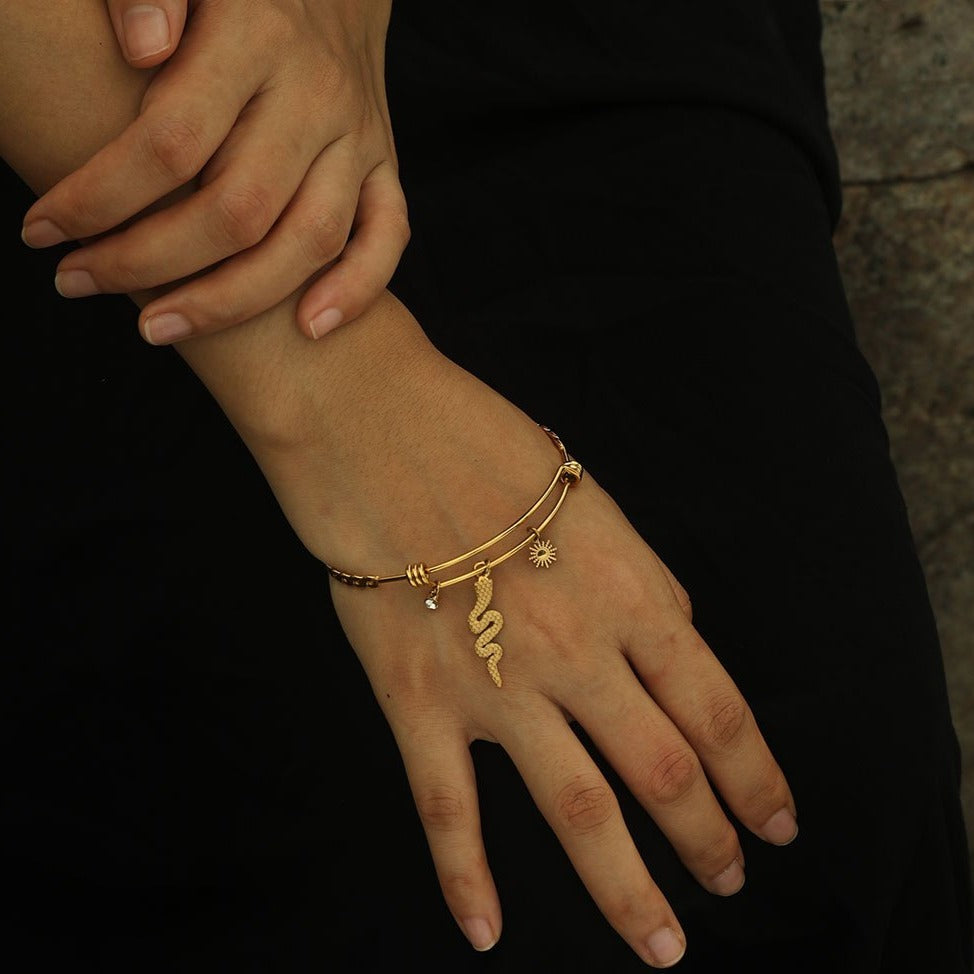 CATALINA Gold: Bracelet with Serpent, Sun Symbol and Zirconia (CZ) Charms - Velora Luxury Fashion