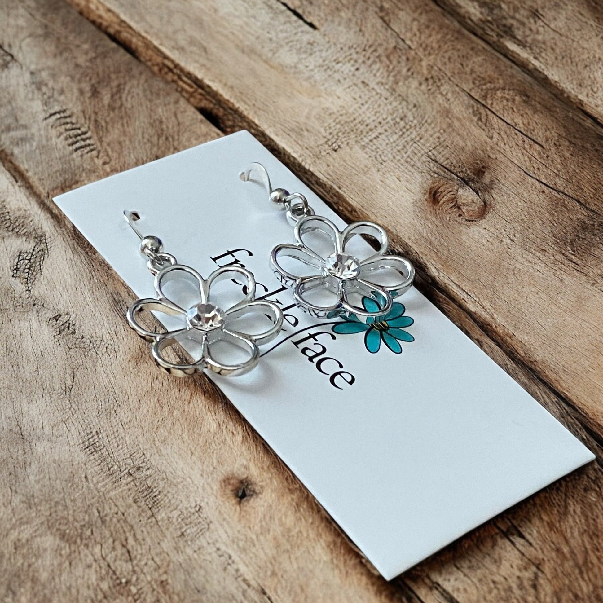 Cutie Patootie Flower Earrings – Silver Floral Dangles with Rhinestone Center - Velora Luxury Fashion