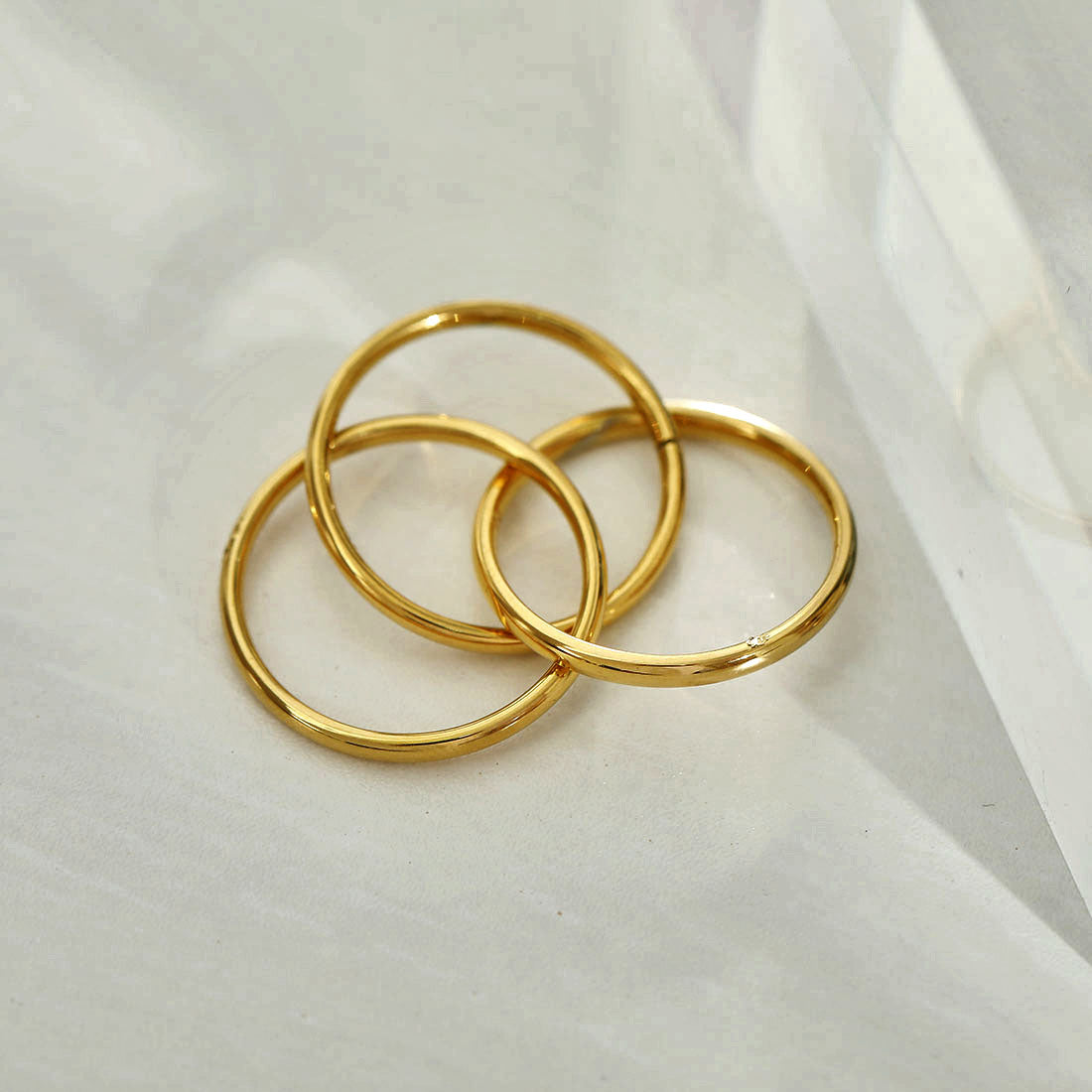 ESTELLA: Triple Banded Interconnected Stack Ring in Gold - Velora Luxury Fashion