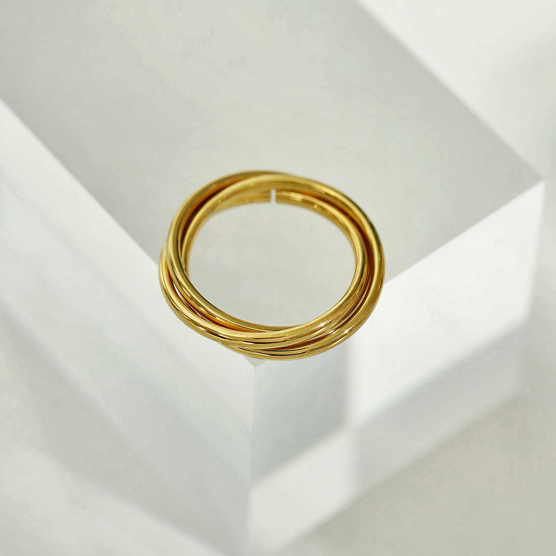 ESTELLA: Triple Banded Interconnected Stack Ring in Gold - Velora Luxury Fashion