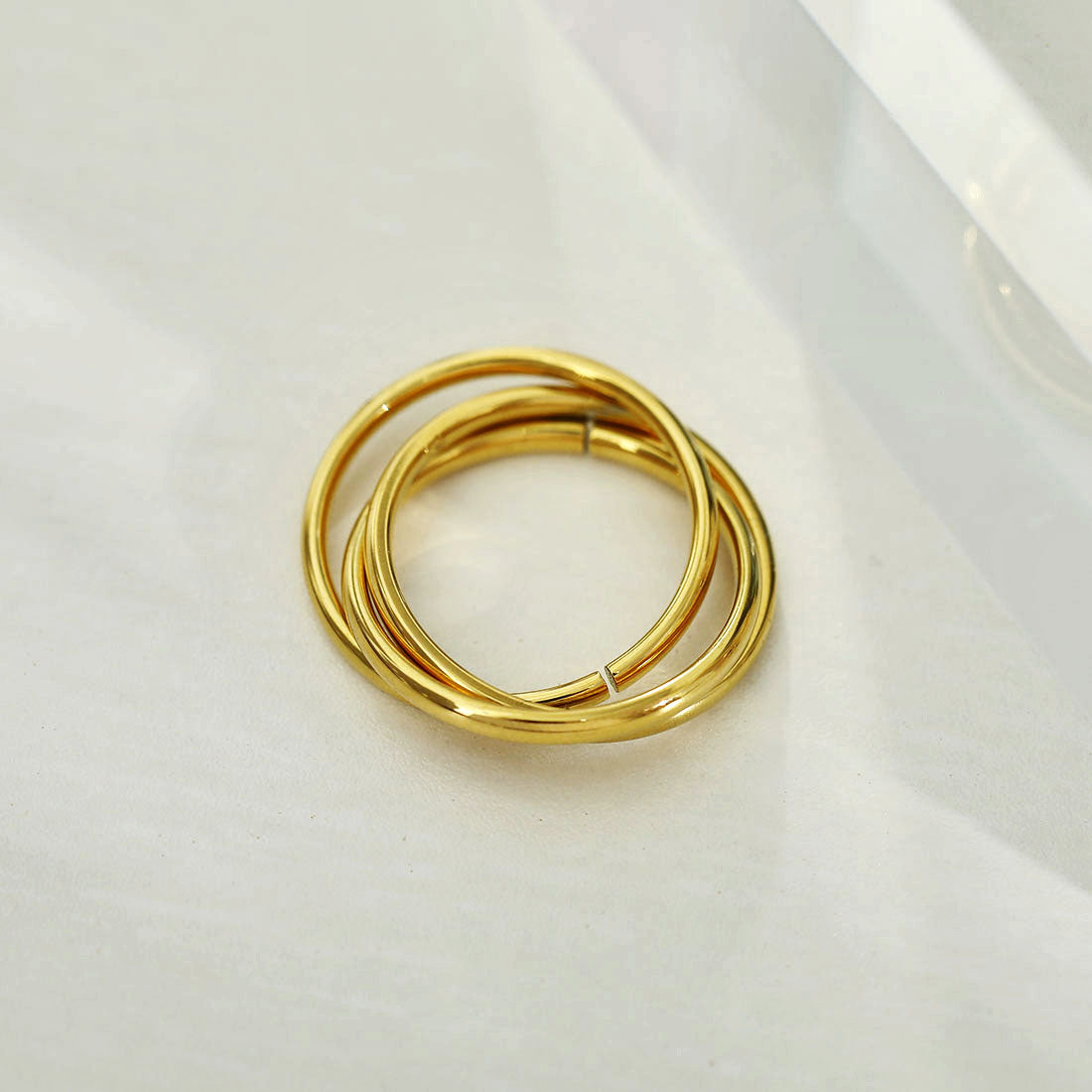 ESTELLA: Triple Banded Interconnected Stack Ring in Gold - Velora Luxury Fashion