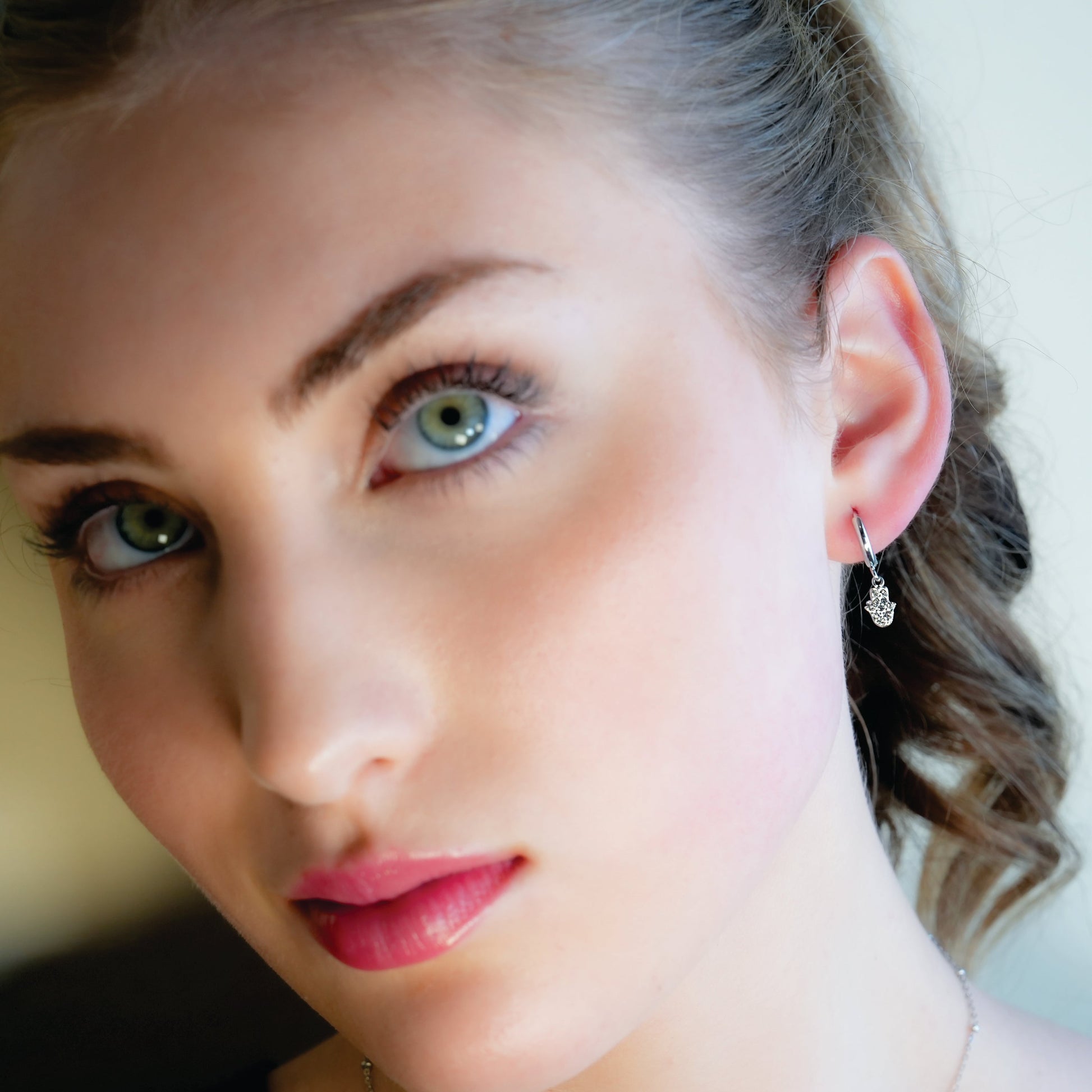 FATIMA White Gold (Silver Toned): Pavé Zirconia (CZ) Mini Hoop Earrings with Hamsa Hand Charm – A Perfect Blend of Style and Protection - Velora Luxury Fashion