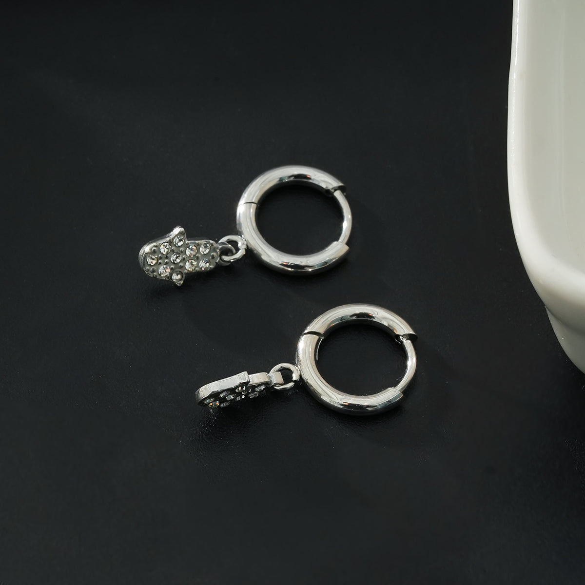FATIMA White Gold (Silver Toned): Pavé Zirconia (CZ) Mini Hoop Earrings with Hamsa Hand Charm – A Perfect Blend of Style and Protection - Velora Luxury Fashion