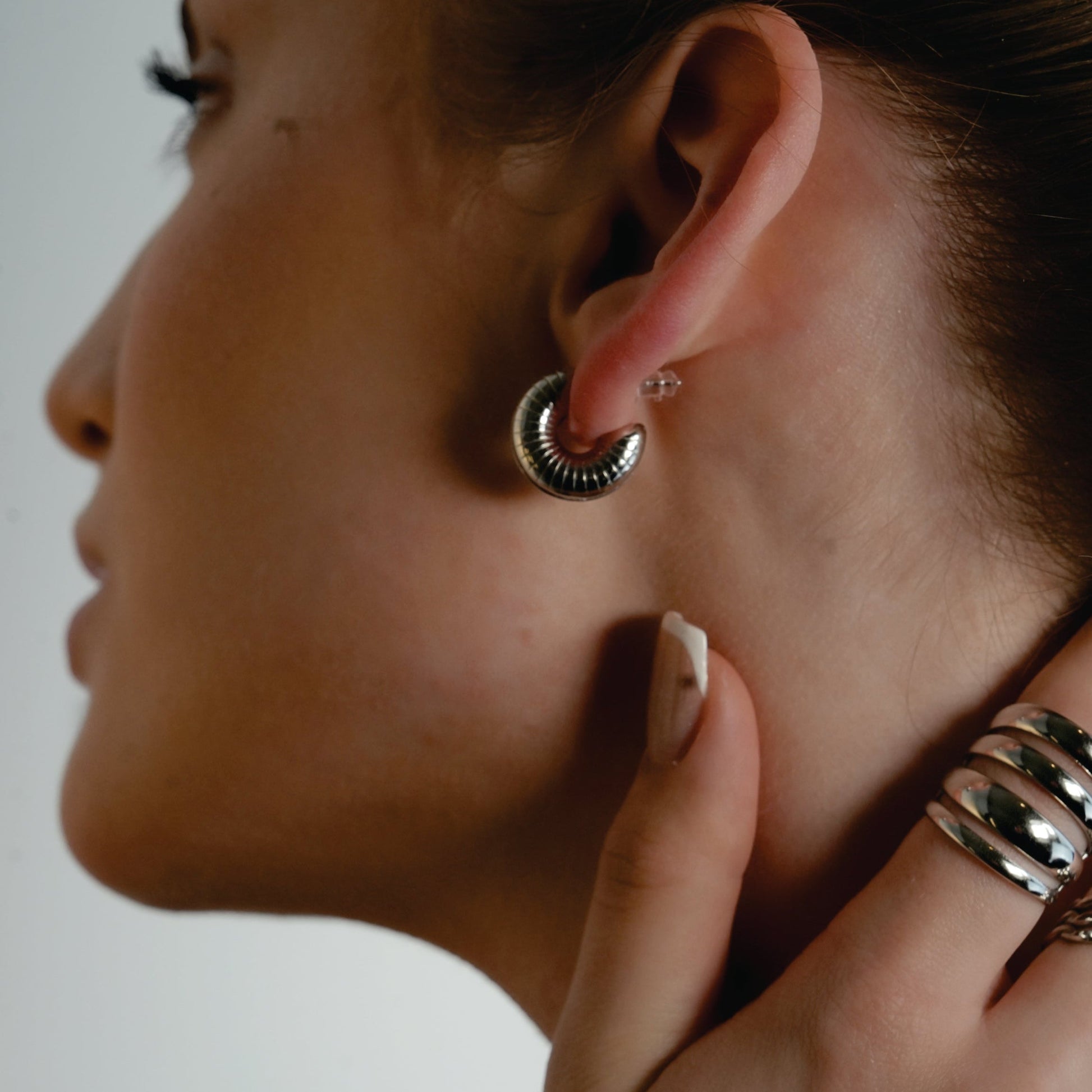 KOTOHIRA: Hollow Chunky-Look Textured Surface Tube Hoop Earrings in Silver Toned White Gold - Velora Luxury Fashion