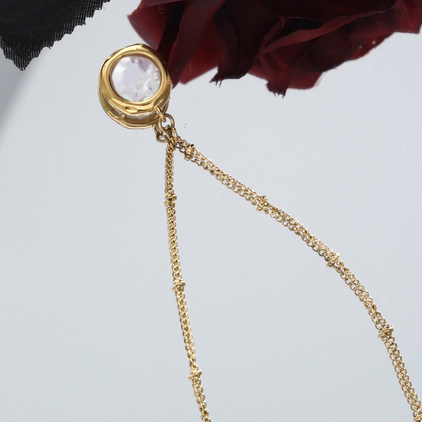 LERATI: Beaded Chain with an Encased Fresh Water Pearl Pendant in Gold - Velora Luxury Fashion
