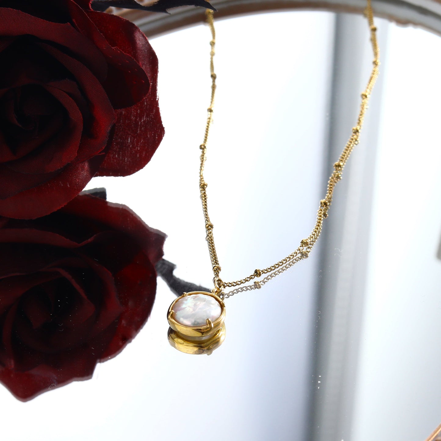 LERATI: Beaded Chain with an Encased Fresh Water Pearl Pendant in Gold - Velora Luxury Fashion