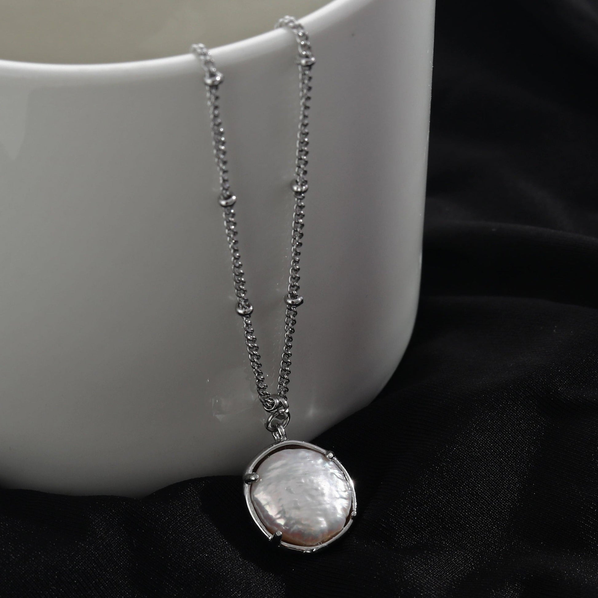 LERATI Beaded Chain with an Encased Fresh Water Pearl Pendant in Silver - Velora Luxury Fashion