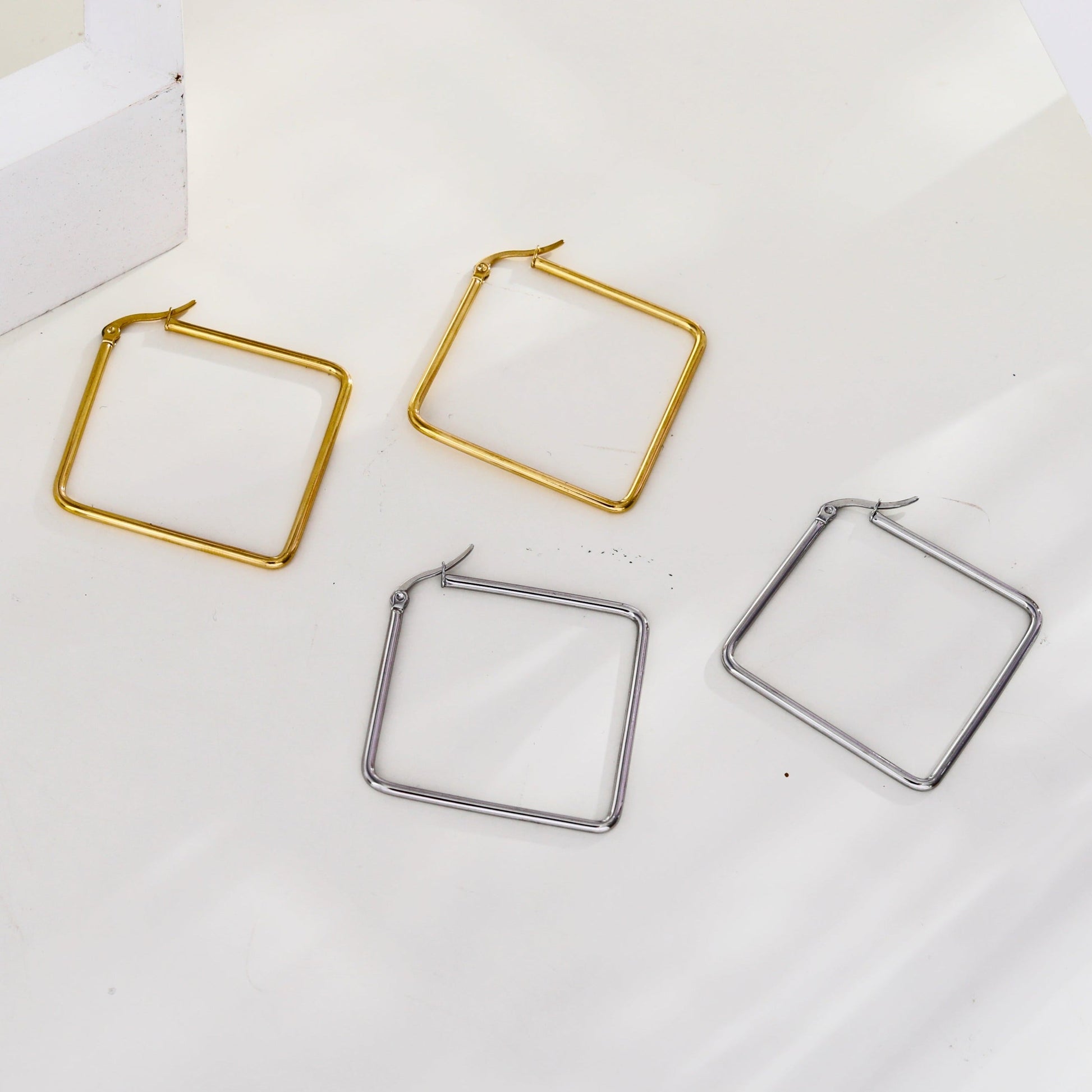 REILYNN: Square Silver Hoops - A Bold Twist on Classic Elegance - Velora