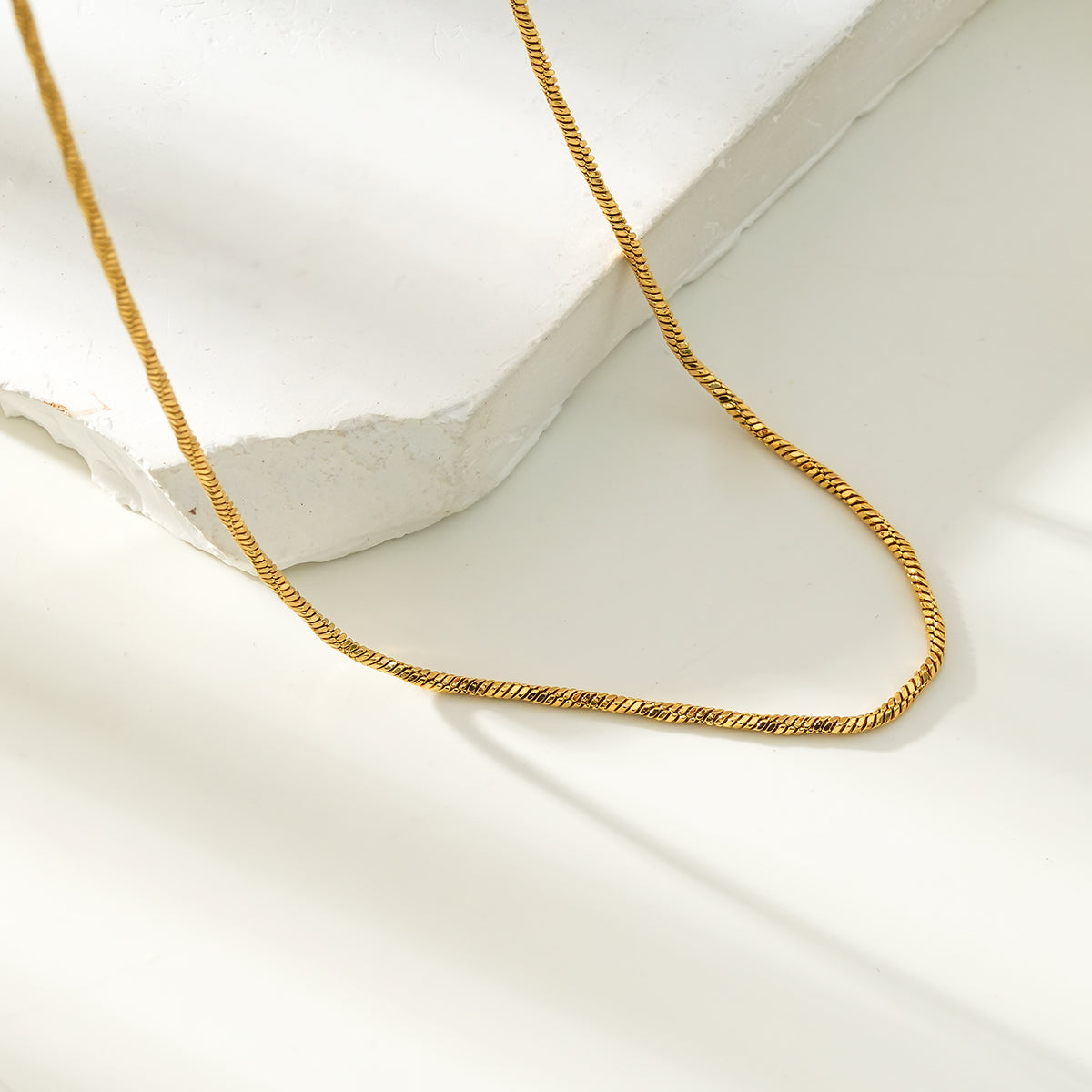 SKAGWAY: Minimalist Twisted Textures Chain Necklace in Gold - Velora Luxury Fashion
