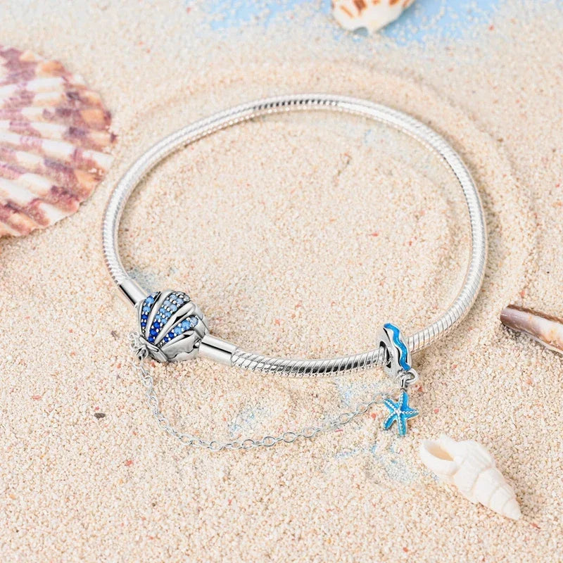Sterling Silver Seashell Charm Bracelet with Blue CZ Gradient - Velora Luxury Fashion