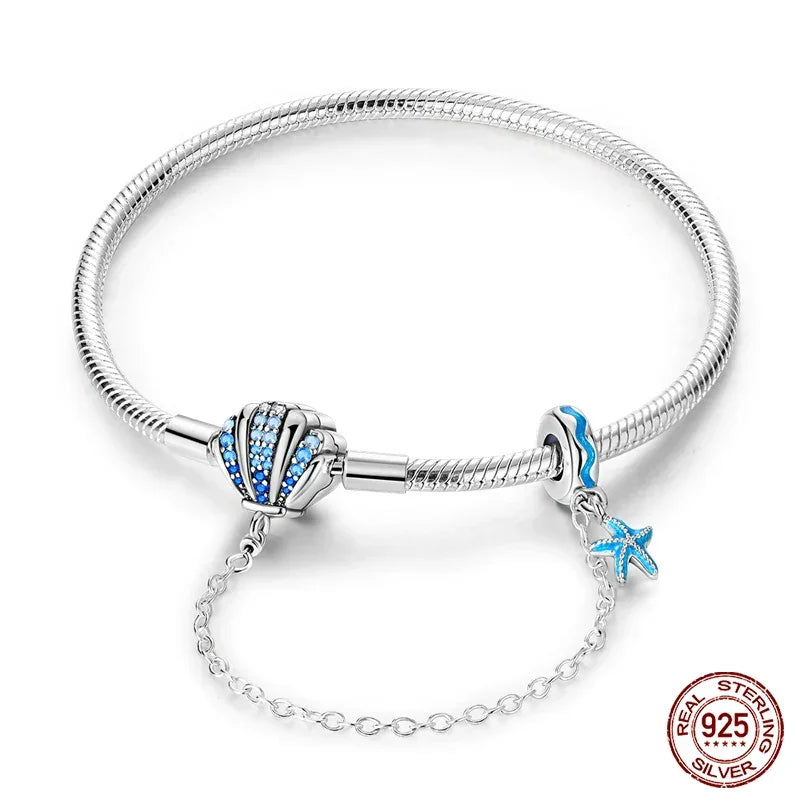 Sterling Silver Seashell Charm Bracelet with Blue CZ Gradient - Velora Luxury Fashion
