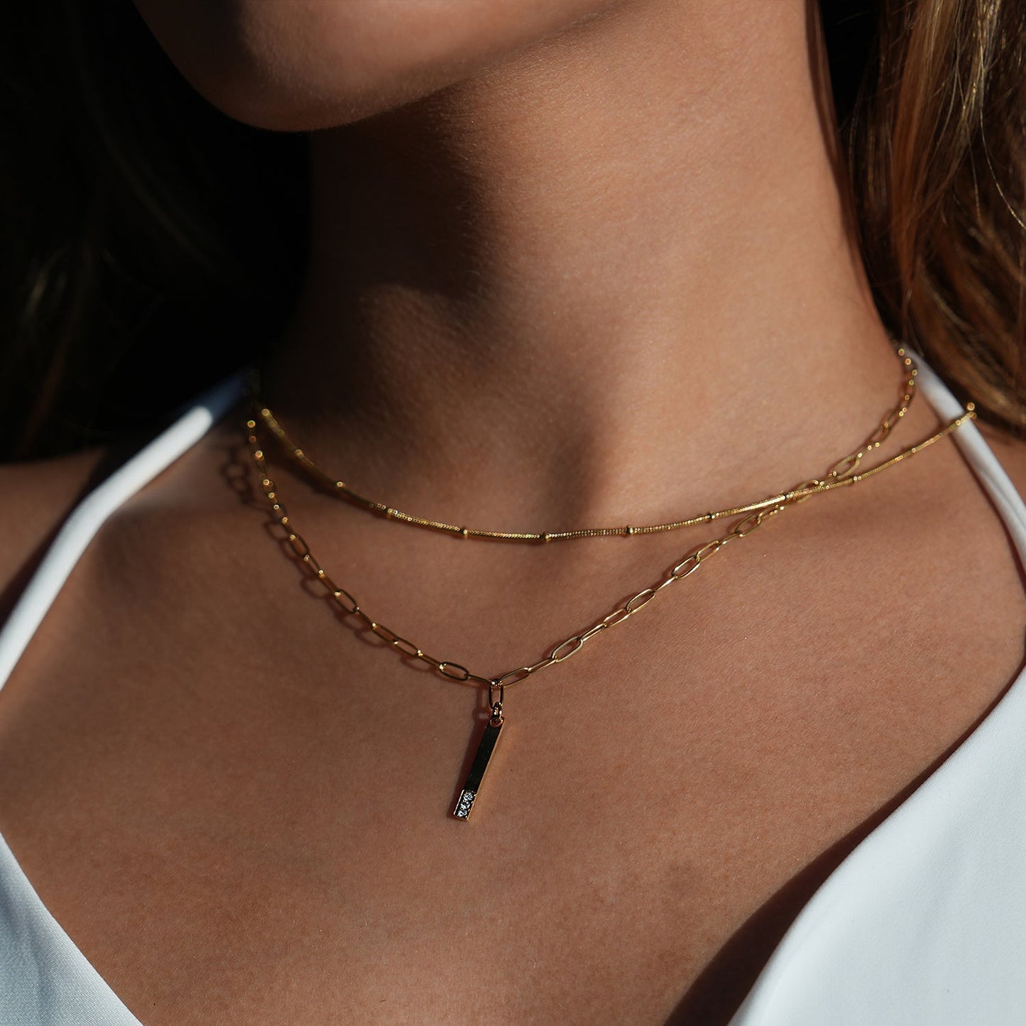 Style KORATIA: Minimalist Necklace with Paper-Clip Chain and Bar Charm Zirconia Embedded Pendant in Gold - Velora Luxury Fashion