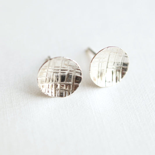 Small round silver or gold studs